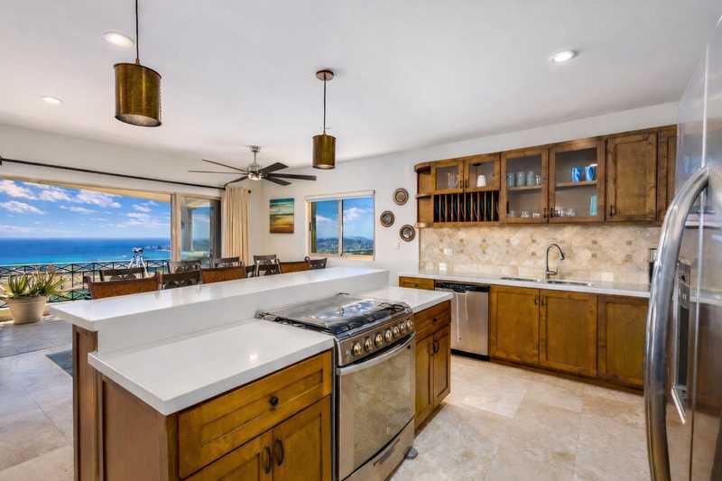 Full kitchen with ocean views at Casa de Corona, a Cabo San Lucas vacation rental