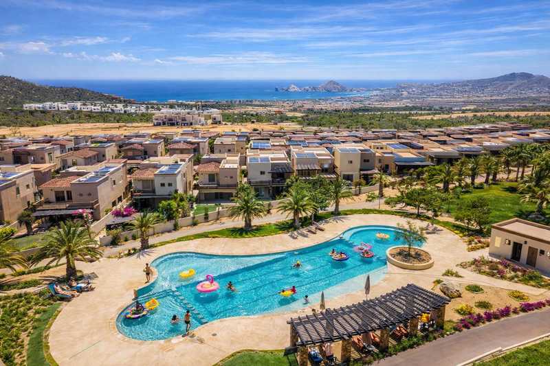 Shared resort pool with Land's End Arch views at El Tezal vacation rental in Cabo San Lucas