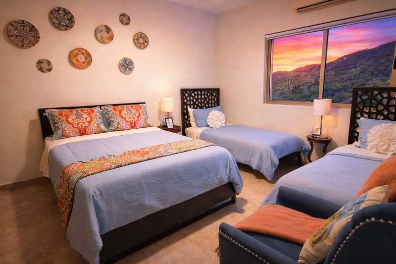 Family suite with queen and twin beds at Casa de Corona, a family-friendly vacation rental in Cabo San Lucas